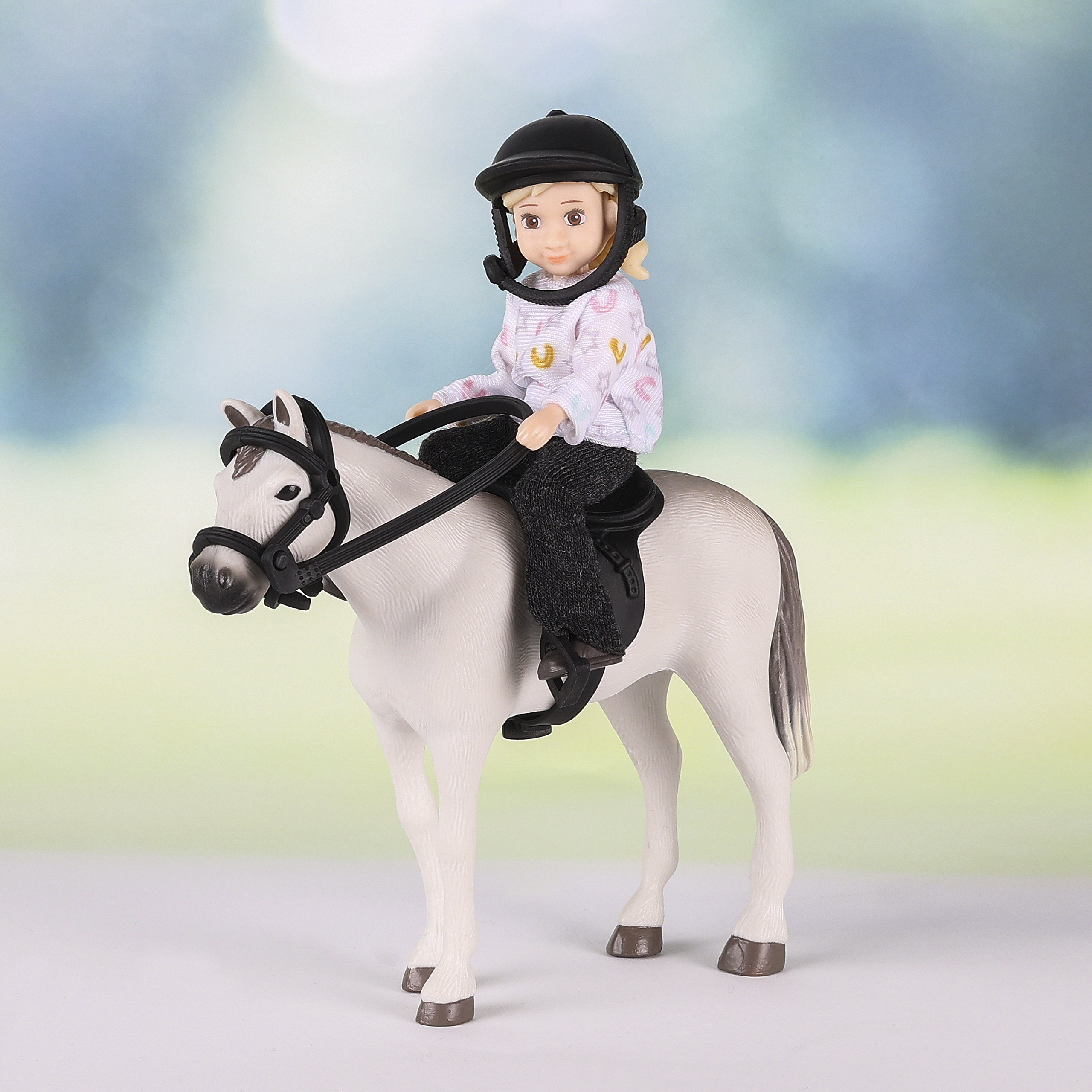 Dolls lundby	dollshouse doll with horse
